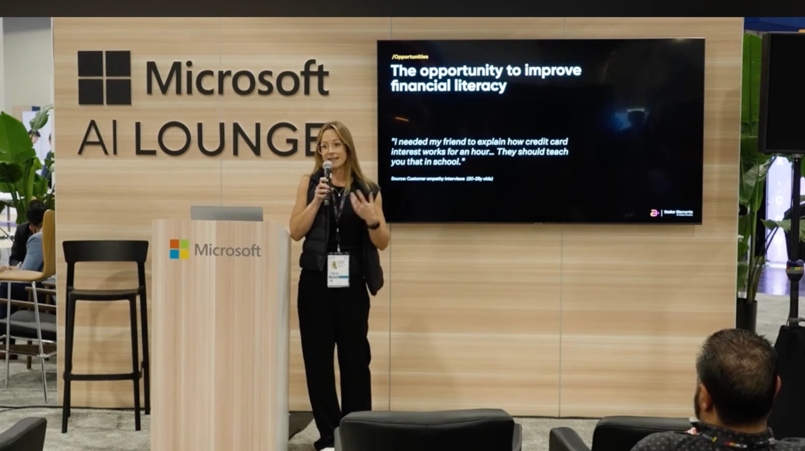 Corinna presenting on financial literacy at the Microsoft AI Lounge, Money20/20